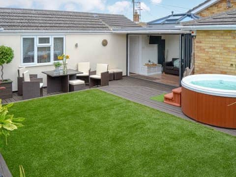 Delightful enclosed garden with private hot tub and sitting out area | Broadland Hideaway, Martham, near Great Yarmouth