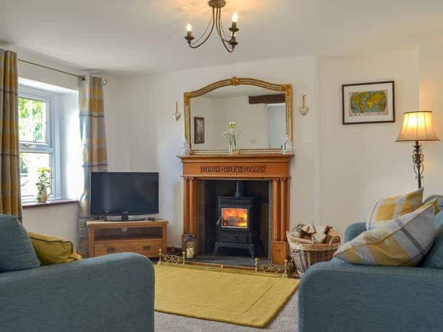 Welcoming living room with a cosy wood burner | Bumblebee Nook, Yanwath, near Pooley Bridge