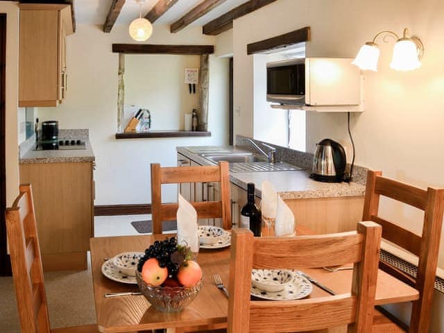 Dining area and adjacent kitchen | Swaledale Cottage - Swaledale and Ellerbeck Cottages, Caldbeck, near Keswick