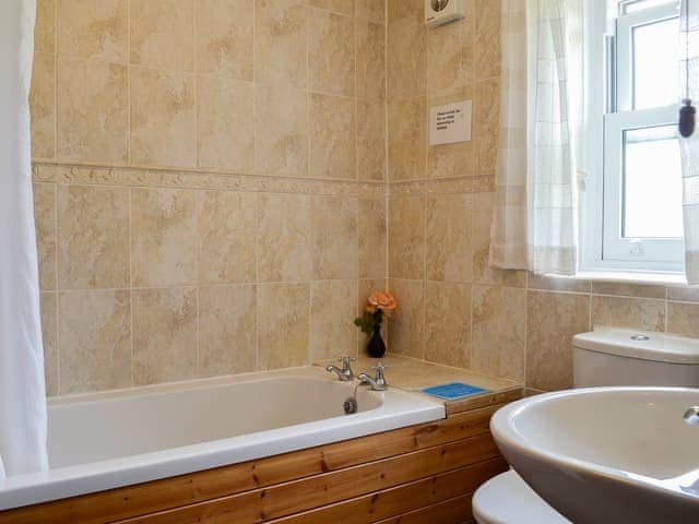 Bathroom with shower over the bath | Swaledale Cottage - Swaledale and Ellerbeck Cottages, Caldbeck, near Keswick