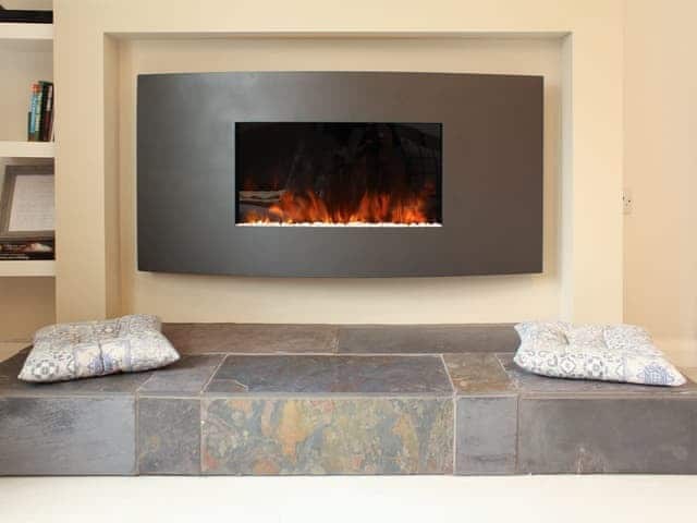 Contemporary wall mounted fire | 12A Elm Court - Greta Grove Apartments, Keswick