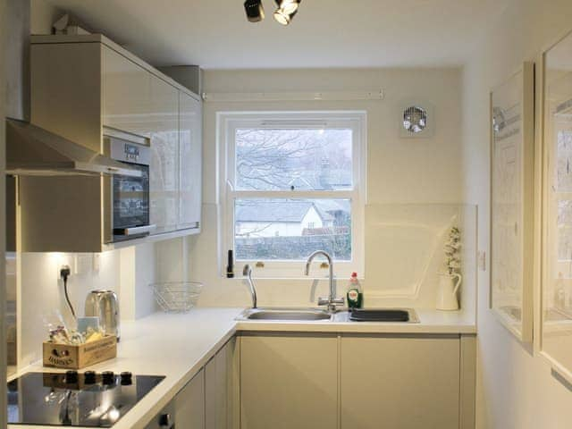 Well-equipped fitted kitchen | 12A Elm Court - Greta Grove Apartments, Keswick