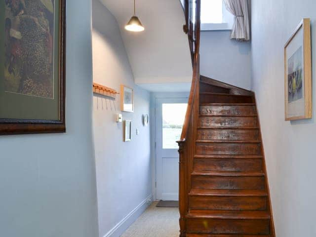 Light and airy hallway with wooden turning staircase | Blackbird House, Alnwick