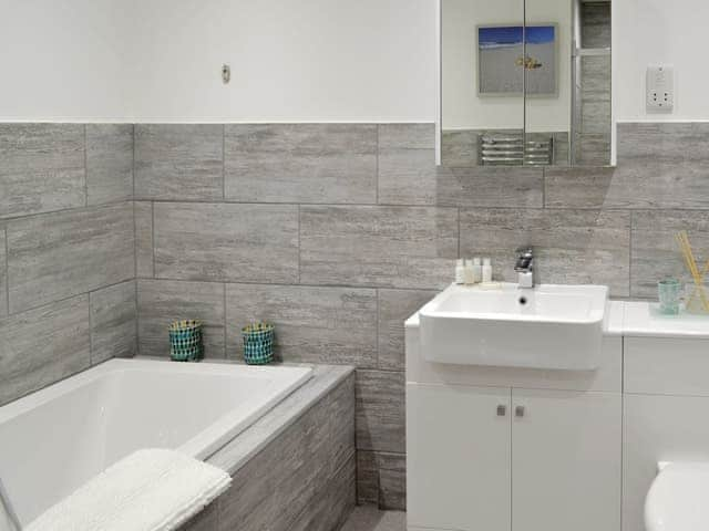 Bathroom with bath and separate shower cubicle | Deepwater Point Apartment, Torquay