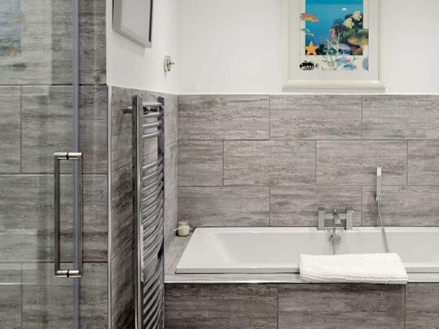 Bathroom with shower cubicle and bath | Deepwater Point Apartment, Torquay