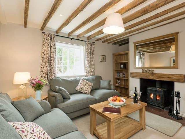 Thoughtfully converted living room with wood burner | Sunnyside, Ludham, near Wroxham