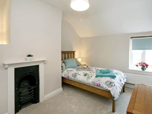 Comfortable twin bedroom with feature fireplace | Sunnyside, Ludham, near Wroxham