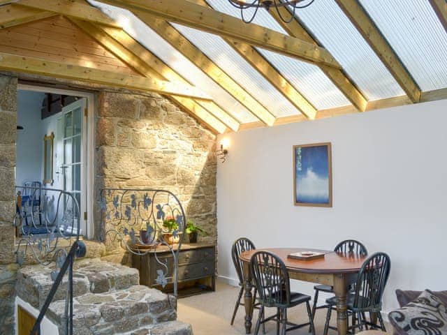 Natural granite steps lead from the living room to the bedroom | Wallhouse Barn, Bodmin