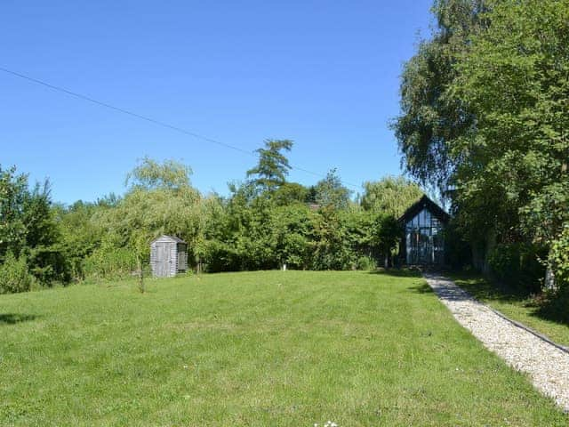 Perfect holiday cottage tucked away in the corner of a large lawned garden | The Studio, Hoe, near Dereham