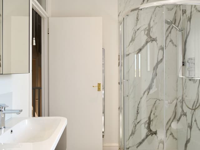 Family bathroom with shower cubicle and bath | Harbour Gates, Maryport