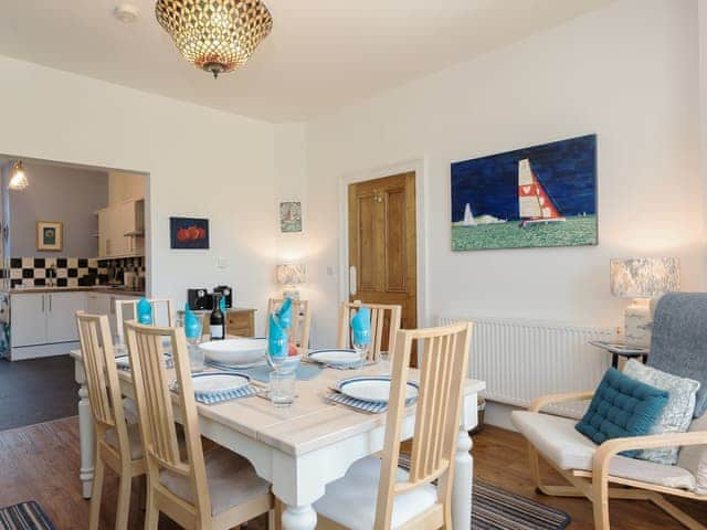 Wonderful dining room leading into the kitchen | Moonbeam House, Freshwater Bay