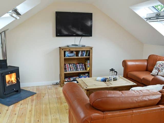 Cosy living area with wood burner | Stonechat Barn - Little Derril, Derril, near Bude