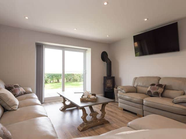 Lounge area with wood burner | Woody&rsquo;s Top, Ruckland, near Louth