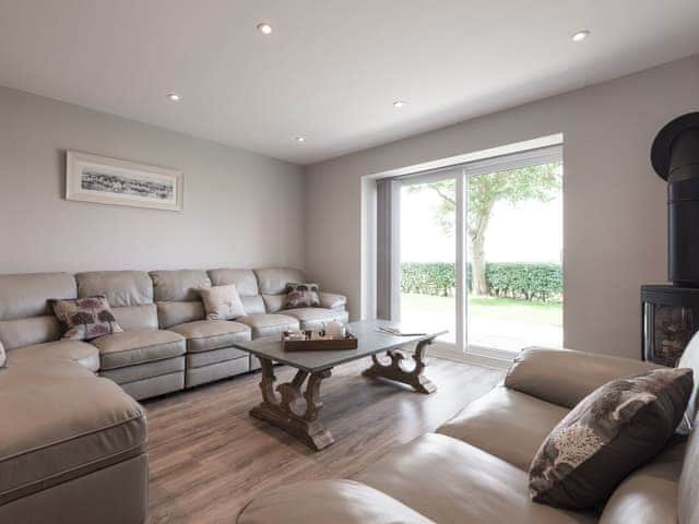 Lounge area with wood burner | Woody&rsquo;s Top, Ruckland, near Louth