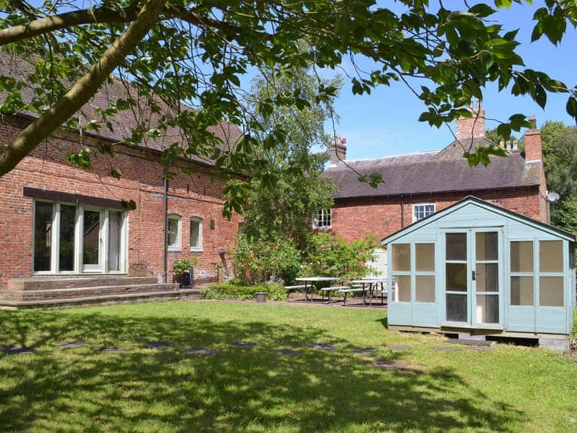 Shared lawned garden with seating and gas BBQ. | Burdett&rsquo;s Cottage, Repton Cottage, Foremark Threshing Barn - Foremark Cottages, Milton, near Repton