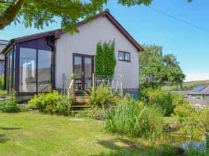 Delightful studio accommodation (unfenced pond in the garden) | Borran Annexe, Oxen Park, near Ulverston