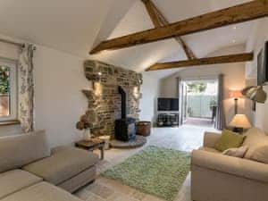 Cosy living room with wood burner | The Old Rectory Cottage, Tothill, near Louth