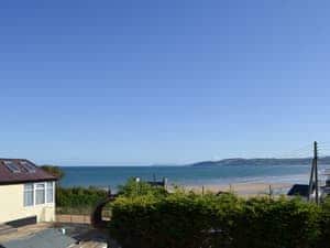Panoramic views from lounge window over Benllech bay towards Puffin Island and Llandudno Great Orme | Beach Cottage, Benllech