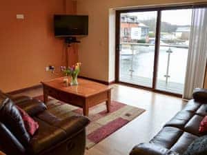 Lounge area with patio doors  | Kestrel Cottage, Horning, near Wroxham