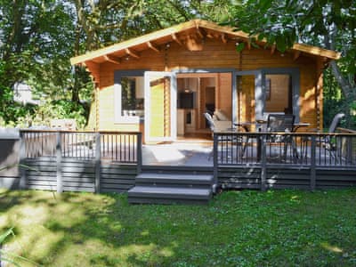 Comfortable and cosy modern, detached lodge in a peaceful woodland setting | Trelispen Lodge, Perran Downs, near Marazion