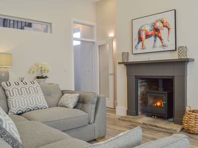 Delightful living room with wood burner | The Station House - Station House Cottages, Upper Poppleton, near York