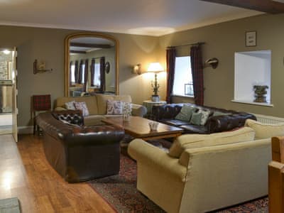 Cosy lounge area | The Shooting Lodge, Colquite, Washaway