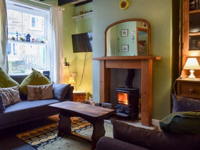 Cosy living room with multi-fuel burner | Flither Cottage, Staithes, near Saltburn-by-the-Sea