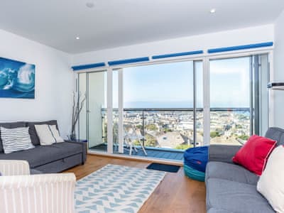 Comfortable living area with access to the balcony | Above Towan @ 8 Quay Court, Newquay