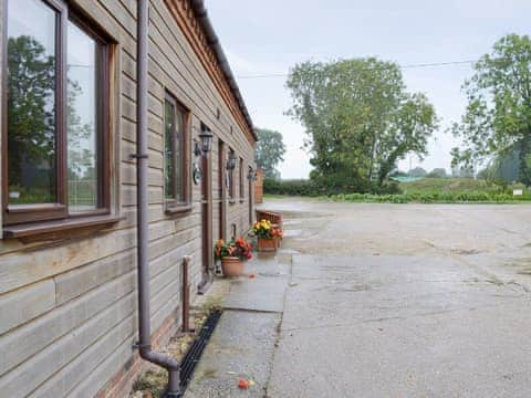 Attractive cottages with large courtyard parking area | Dairy Cottage - Moor Farm Stable Cottages, Foxley, near Fakenham