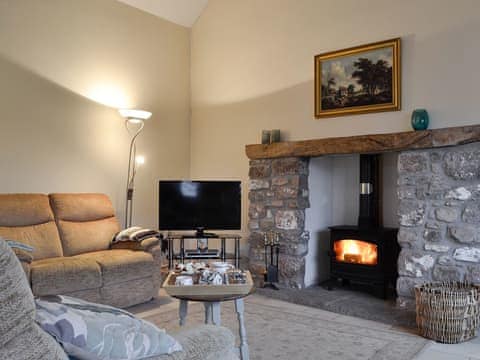 Lounge area with wood burner | The Old Byre, Middleton, near Swansea