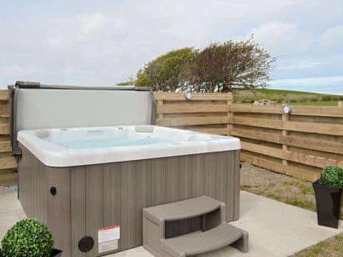 Luxurious hot tub | Llofft Storws - Bronallt Barns, Llanynghenedl, near Holyhead