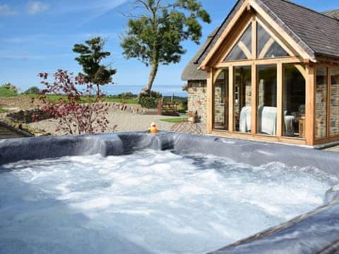 Relax in the sumptuous private hot tub | Soar Cottage, Dihewyd, near Aberaeron