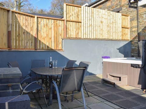 Paved patio area with hot tub and barbecue | Stabl - Bwlch Y Person Barns, Dihewyd, near Aberaeron