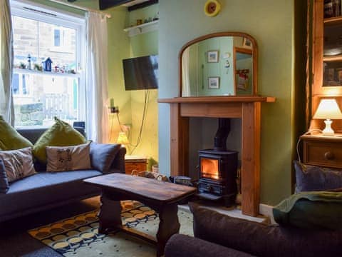 Cosy living room with multi-fuel burner | Flither Cottage, Staithes, near Saltburn-by-the-Sea