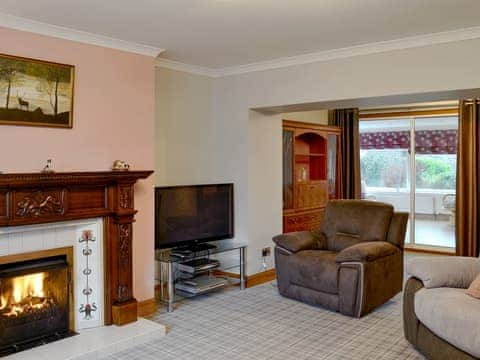 Charming living room with an open fire | Hawthorn Cottage, Stranraer