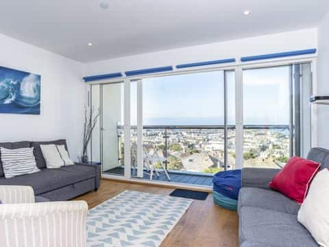 Comfortable living area with access to the balcony | Above Towan @ 8 Quay Court, Newquay