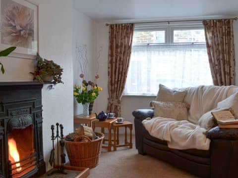 Living room with open fire | Bridgend Cottage, Lostwithiel