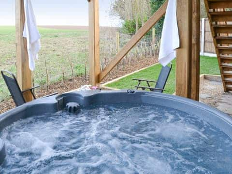 Enclosed garden area with hot tub | The Cart Shed - Swafield Barns, Swafield, near North Walsham