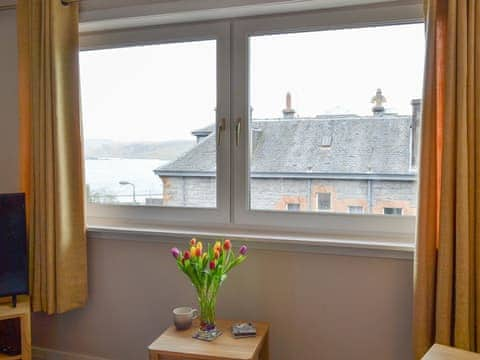 Living/dining room with a wonderful view | Finlaggan Apartment, Oban