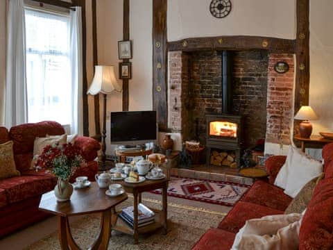 Cosy living room with wood burner | Star Cottage, Eye