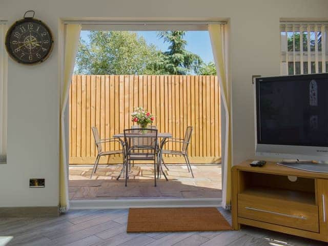 Living area leading to patio | Albert Apartment, Poole