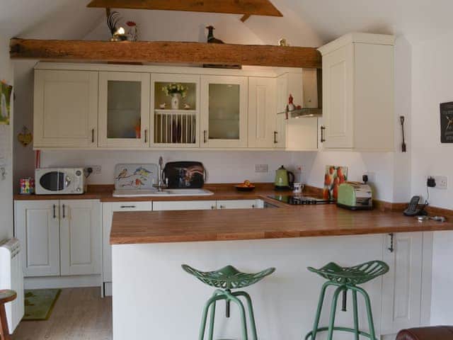 Kitchen with breakfast bar | The Olde Barn, Welton, near Lincoln