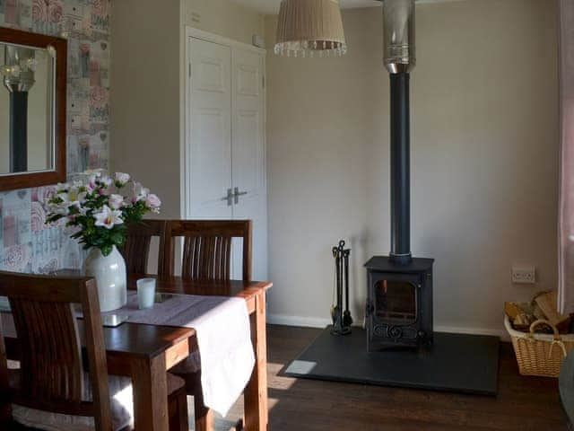 Dining area with wood burner | Westville by the Stream, Rosecraddoc, near Liskeard