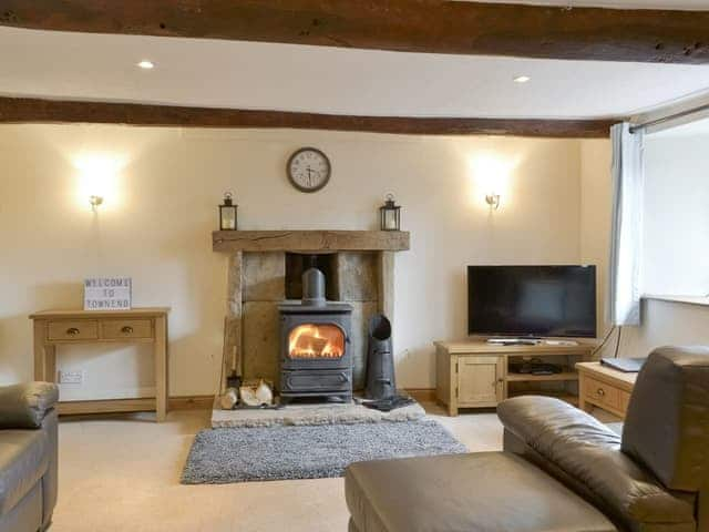 Welcoming living area with wood burner | Townend Cottage, Soulby, near Kirkby Stephen