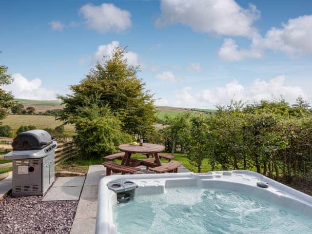 Hot tub and BBQ area | Rue Hayes Farm Cottage, Onecote, near Leek