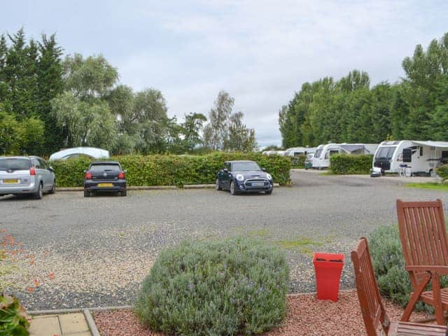 Parking area with small camp site to rear | Stable Cottage, Dove Cottage, Rose Cottage - Railway Cottages, Acklington, near Amble