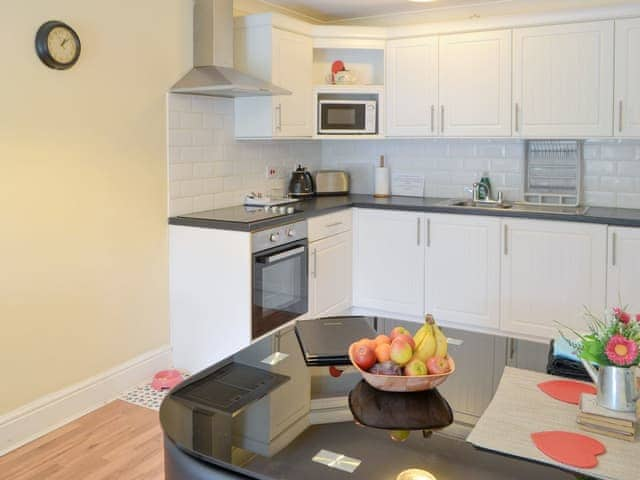 Dining area and well-equipped fitted kitchen | Dove Cottage - Railway Cottages, Acklington, near Amble