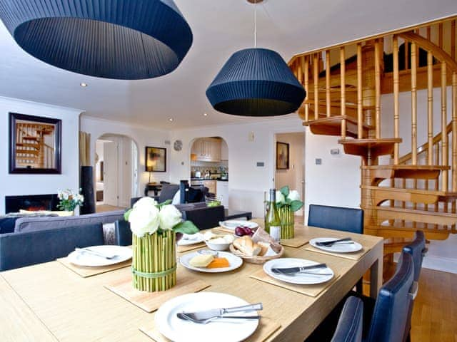 Dining area with spiral staircase to the first floor | Honeysuckle - Woodland Retreat, Wadebridge