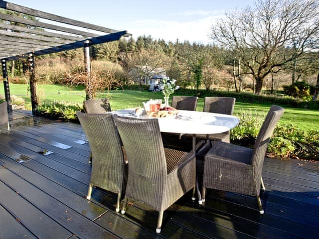 Lovely decked area with table and chairs | Rose - Woodland Retreat, Wadebridge