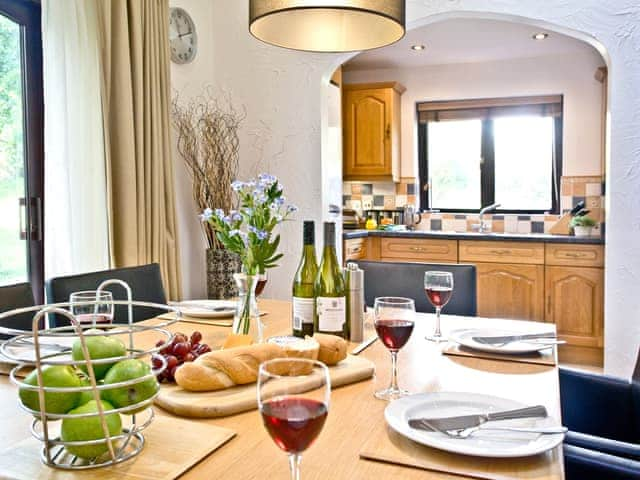 Family dining area with adjacent kitchen | Rose - Woodland Retreat, Wadebridge